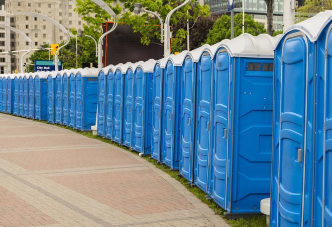 a row of portable restrooms at a fairground, offering visitors a clean and hassle-free experience in portales